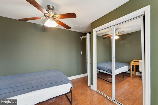 bedroom featuring a closet, ceiling fan, and light hardwood / wood-style floors