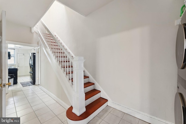 stairs featuring tile patterned flooring