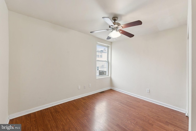 unfurnished room featuring hardwood / wood-style floors and ceiling fan