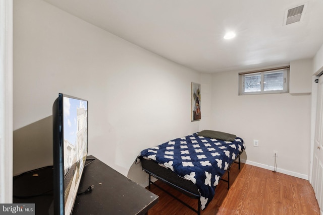 bedroom featuring hardwood / wood-style floors