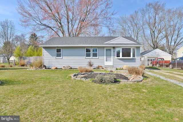 ranch-style house with a shingled roof, a front yard, fence, and dirt driveway