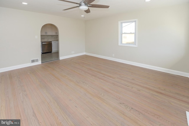 unfurnished room featuring ceiling fan and light wood-type flooring