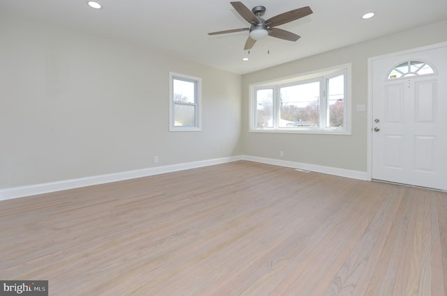 entrance foyer with light hardwood / wood-style flooring and ceiling fan