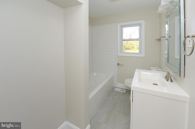 bathroom with tile patterned flooring, vanity, and toilet