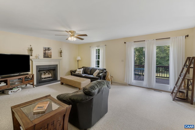 living room with carpet flooring and ceiling fan