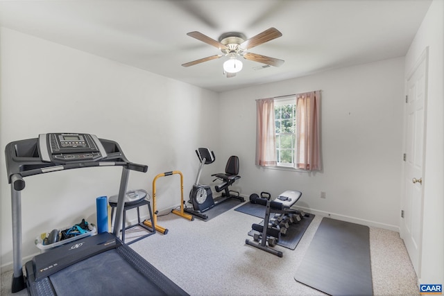 workout area with ceiling fan and carpet floors