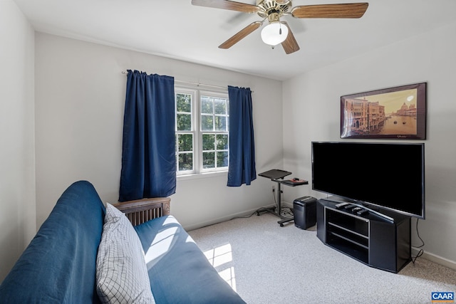 living room with radiator heating unit, ceiling fan, and carpet flooring