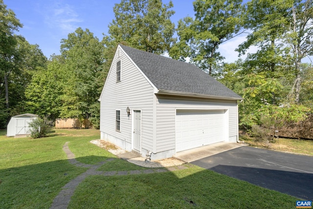 garage featuring a lawn