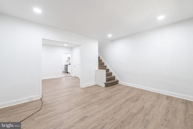 basement featuring light hardwood / wood-style floors