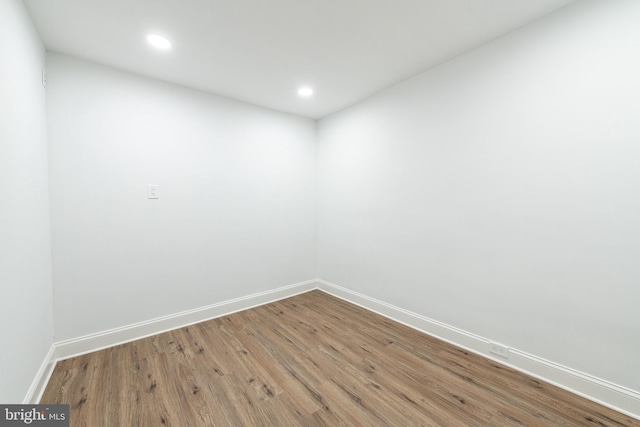 spare room with hardwood / wood-style floors