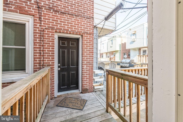 entrance to property with a deck