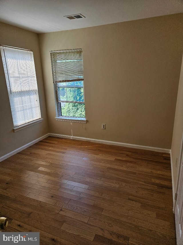 empty room featuring dark hardwood / wood-style floors