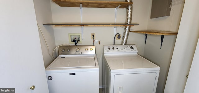 washroom with washer and clothes dryer