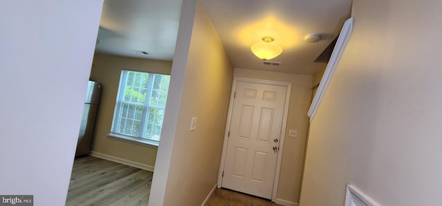 doorway with light hardwood / wood-style flooring