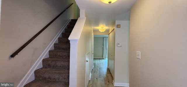 stairs with wood-type flooring