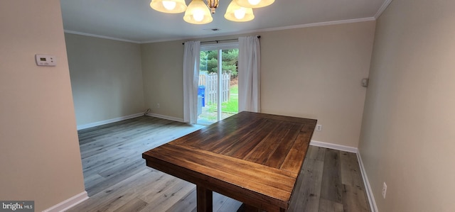 unfurnished dining area with light hardwood / wood-style flooring and ornamental molding