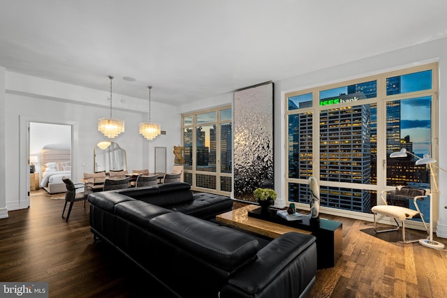 living room with a chandelier and hardwood / wood-style flooring