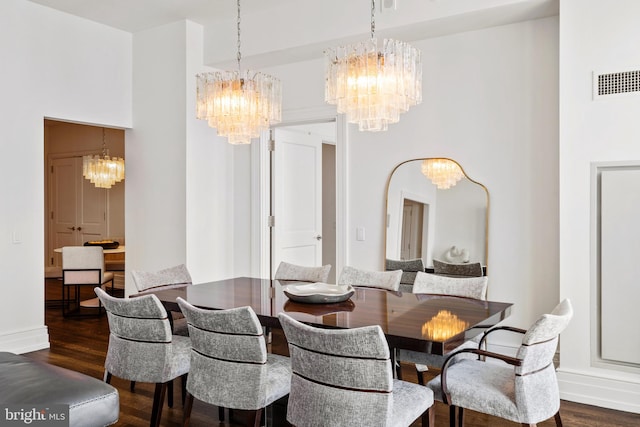 dining area with dark hardwood / wood-style floors