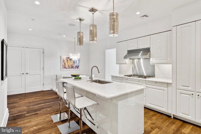 kitchen with white cabinets, dark hardwood / wood-style floors, and sink