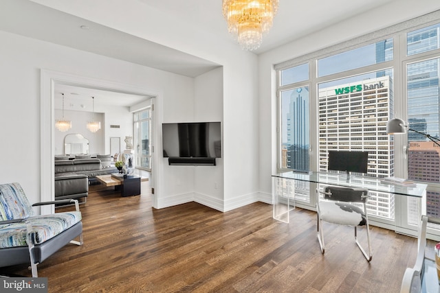 office space featuring hardwood / wood-style floors and a chandelier