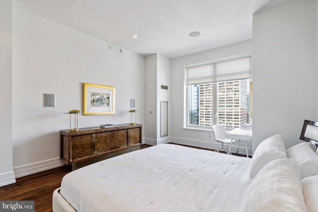 bedroom featuring dark hardwood / wood-style flooring