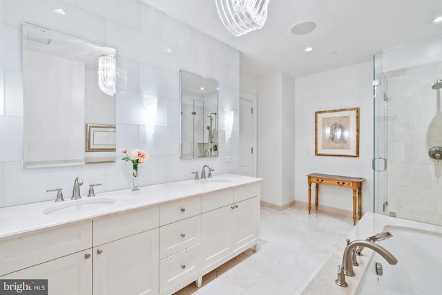 bathroom featuring tile patterned flooring, vanity, and independent shower and bath