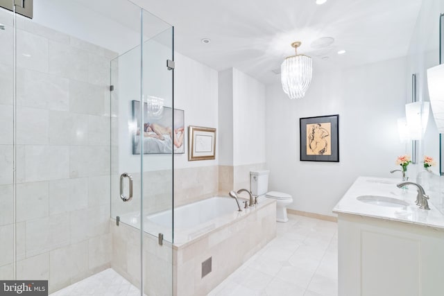 full bathroom with vanity, tile patterned floors, separate shower and tub, toilet, and a notable chandelier