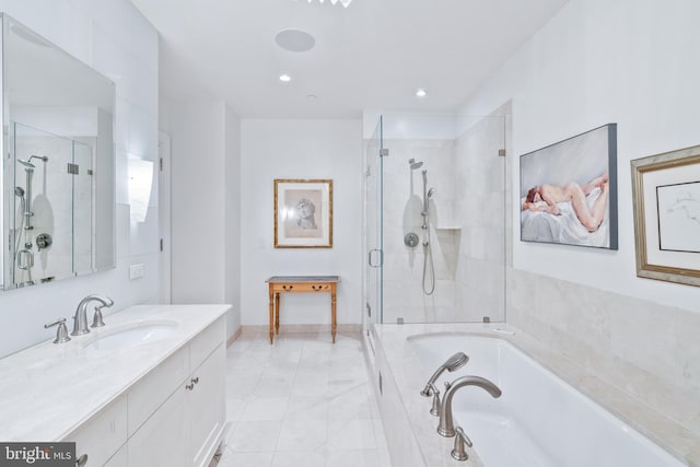 bathroom featuring vanity and shower with separate bathtub