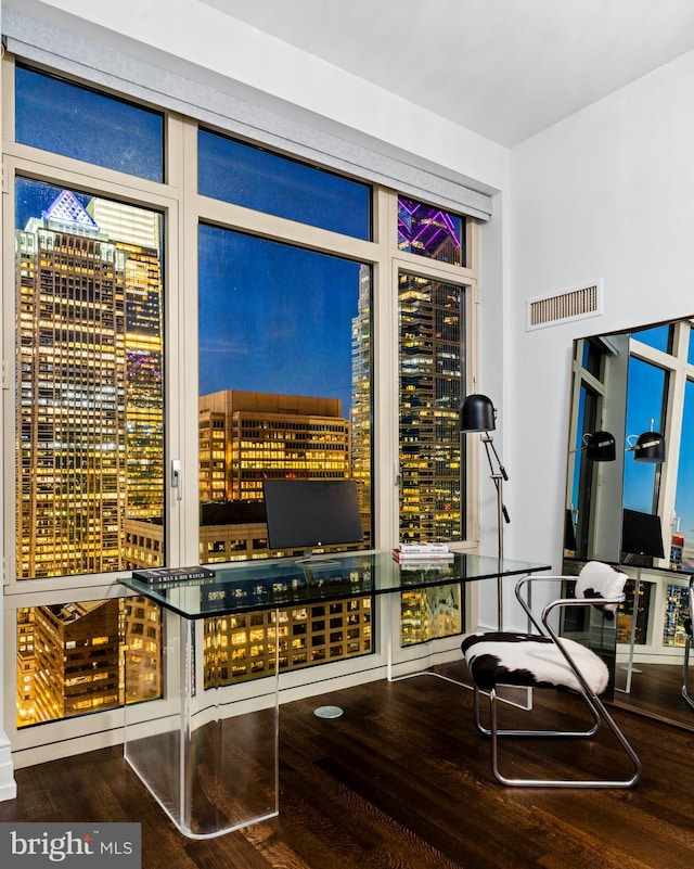 wine area with hardwood / wood-style flooring