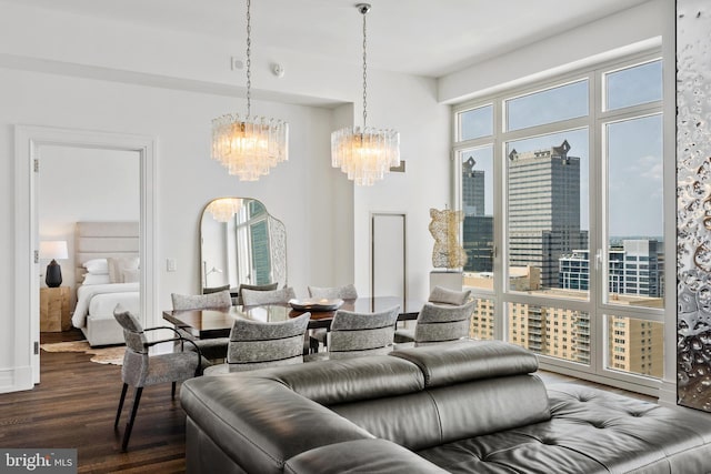 living room featuring dark hardwood / wood-style floors and a notable chandelier