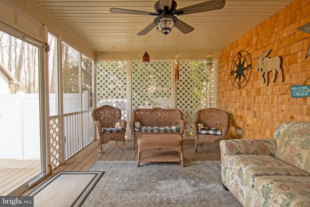 sunroom / solarium featuring wood ceiling and ceiling fan