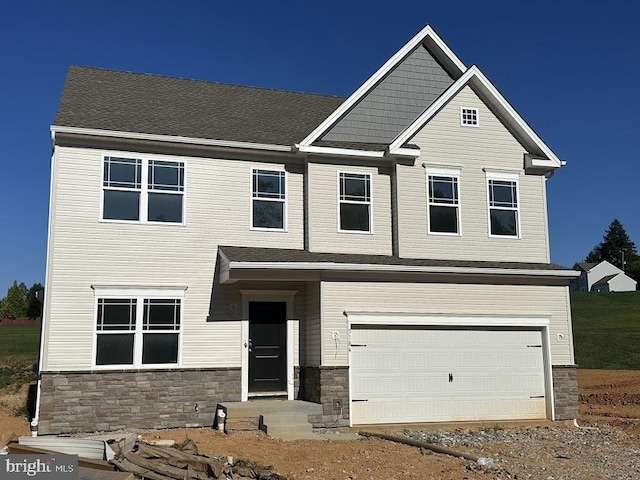 craftsman-style home with a garage