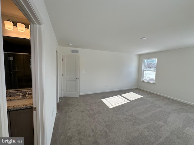 view of carpeted spare room