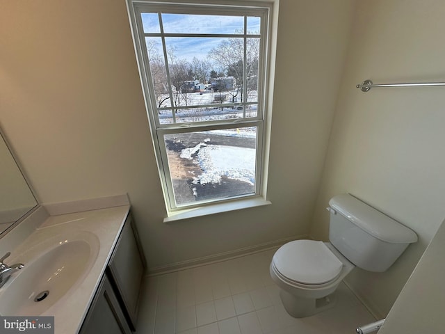 bathroom featuring tile patterned flooring, vanity, and toilet