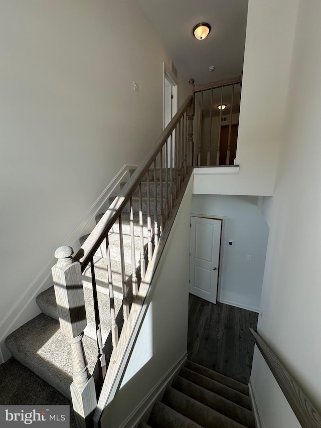 staircase featuring hardwood / wood-style floors