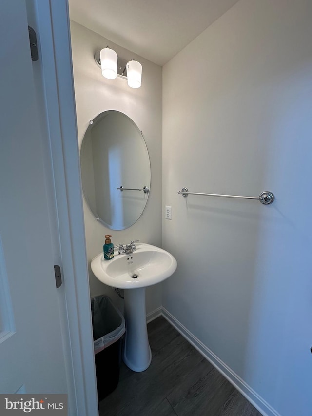 bathroom with wood-type flooring