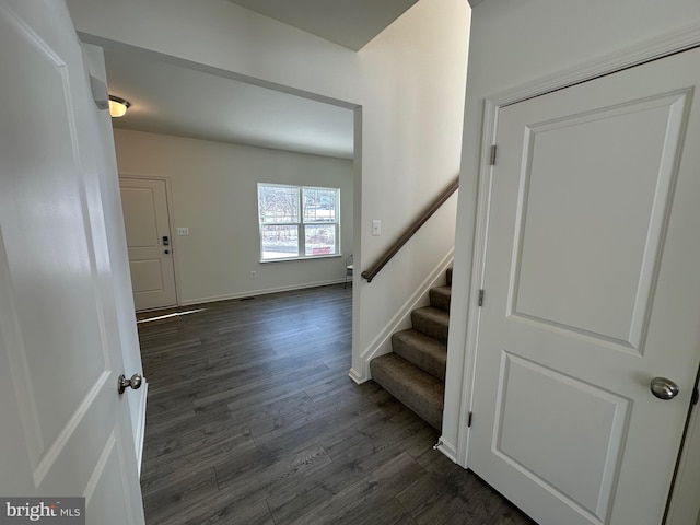 staircase featuring hardwood / wood-style flooring