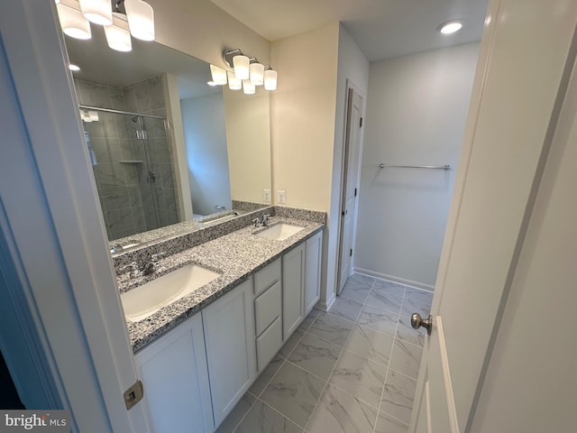 bathroom featuring walk in shower and vanity