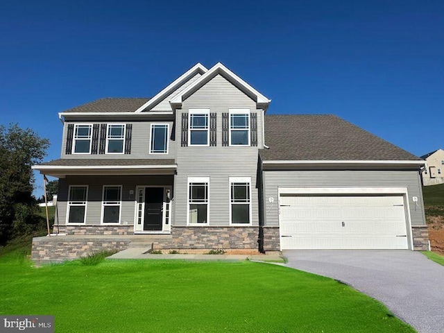 craftsman-style house with a porch, a garage, and a front lawn