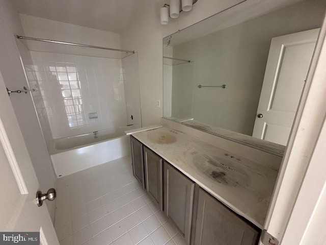 bathroom with vanity, shower / bathtub combination, and tile patterned flooring