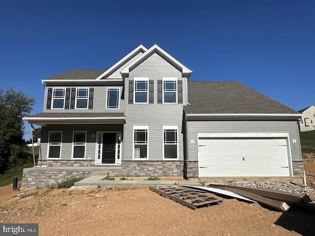 craftsman-style home featuring a garage and a porch