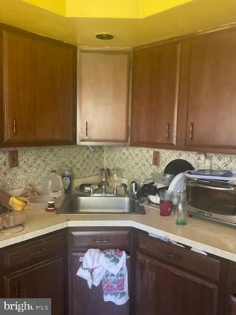 kitchen with sink and tasteful backsplash