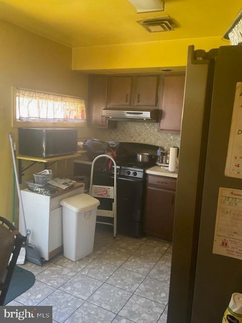 laundry room with light tile patterned floors