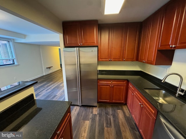 kitchen featuring dark hardwood / wood-style floors, appliances with stainless steel finishes, and sink