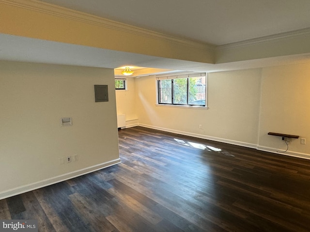 unfurnished room featuring crown molding and dark hardwood / wood-style flooring