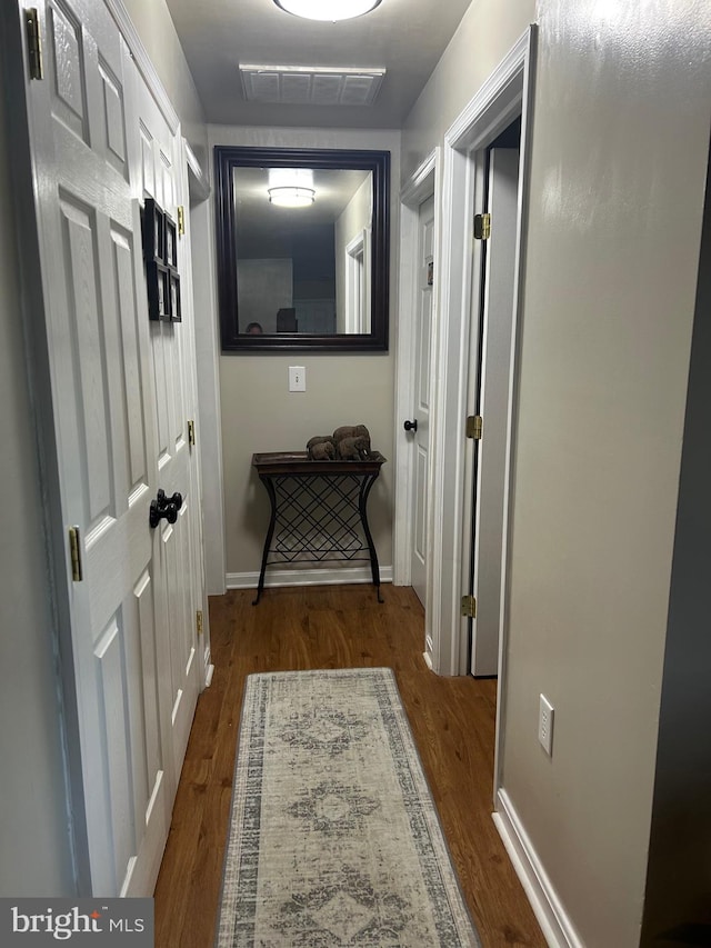 hallway featuring hardwood / wood-style floors