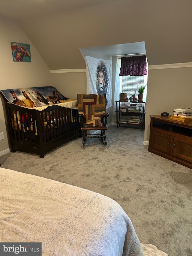 bedroom featuring lofted ceiling, carpet flooring, and crown molding