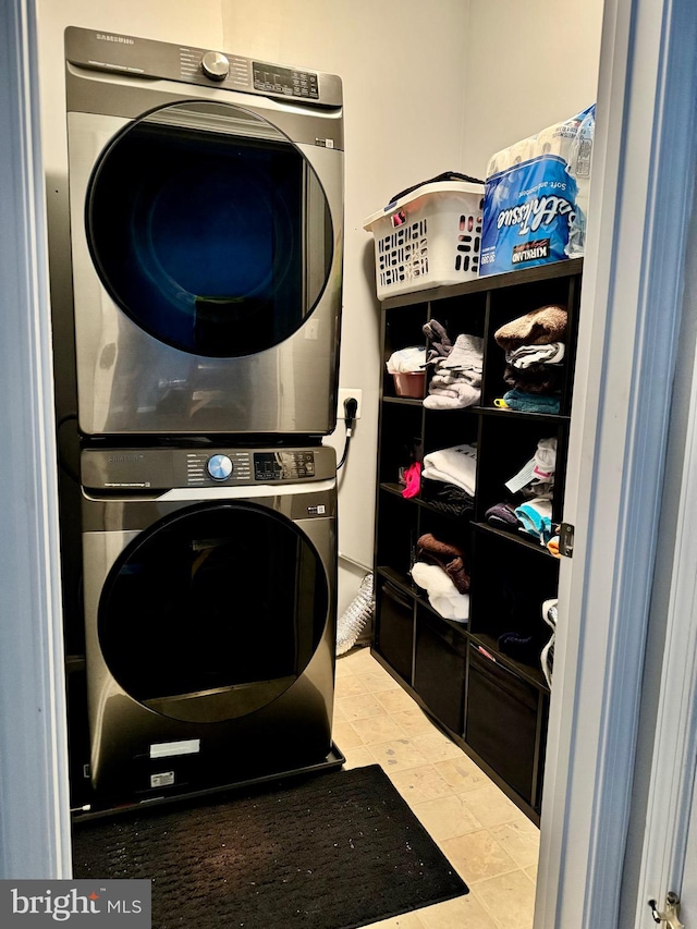 clothes washing area with stacked washer / drying machine