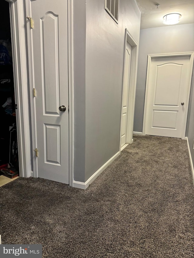 hallway featuring carpet flooring