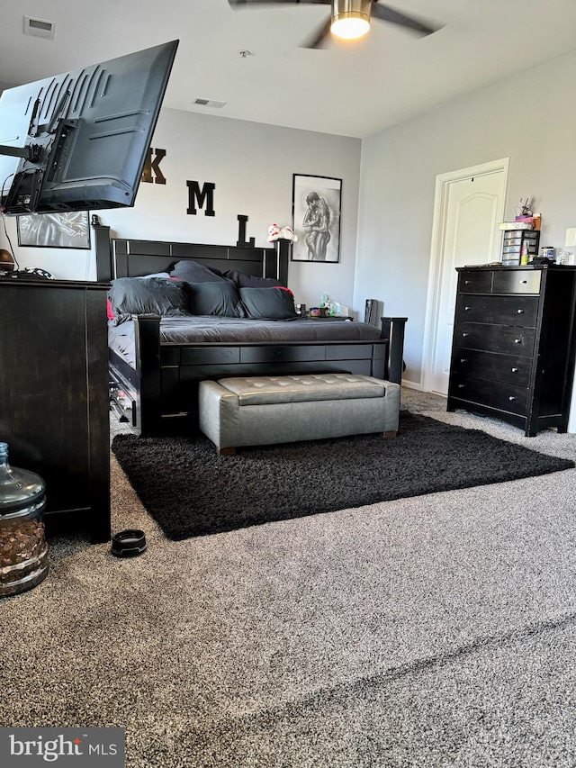 carpeted bedroom with ceiling fan